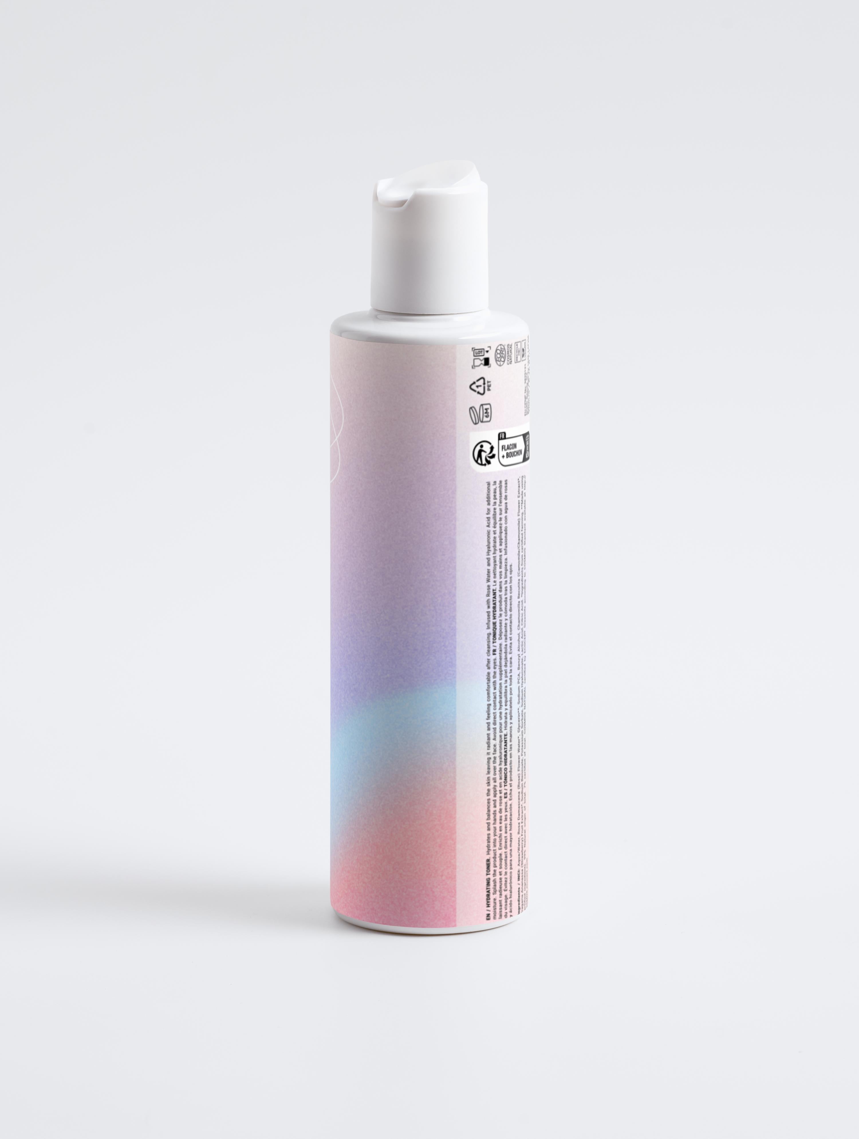 Erinelle Beauty natural hydrating toner in a gradient pink and blue bottle with white cap