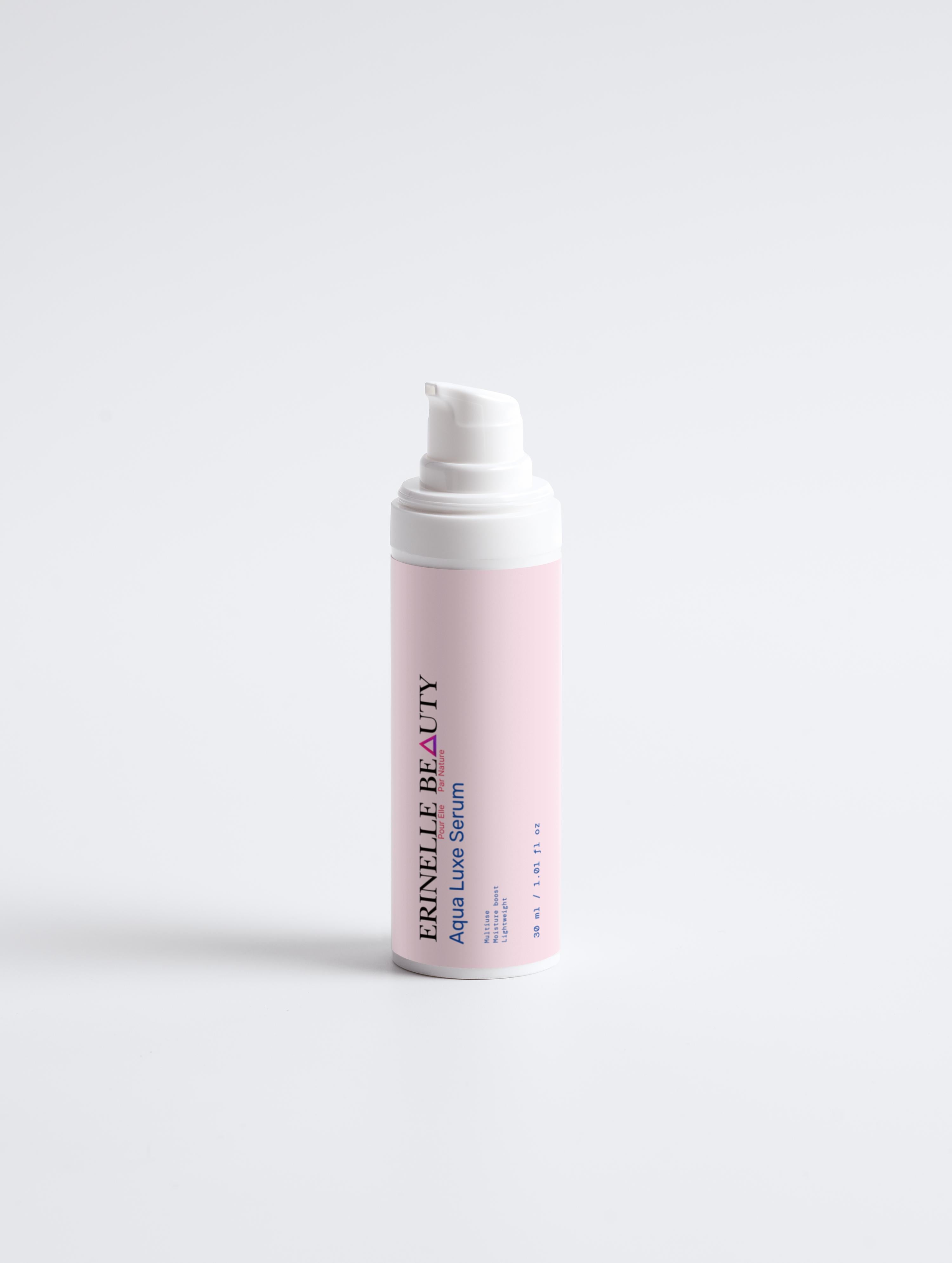 Erinelle Beauty Aqua Luxe Serum for glowing skin in a pink and white pump bottle